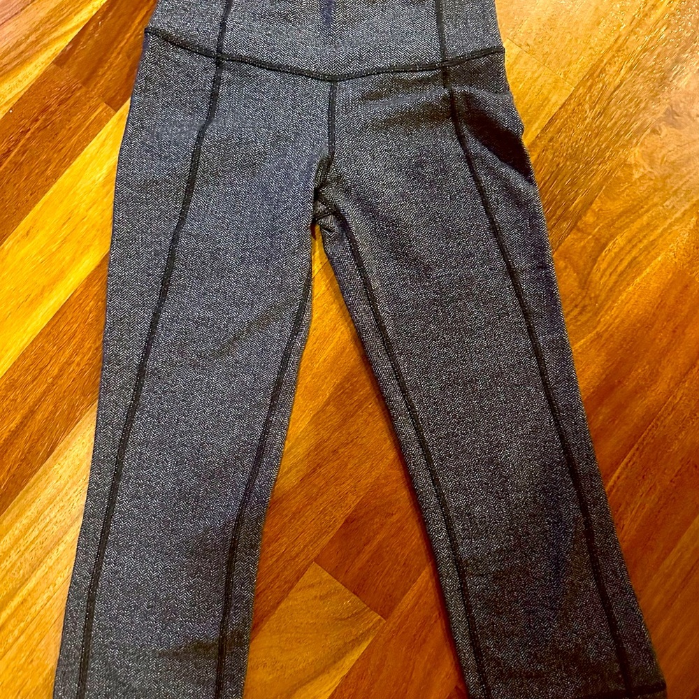 Woman’s small Lululemon mid calf length, black herringbone pattern.